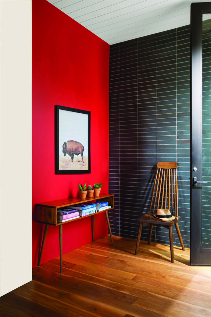 Red Accent Wall with Wooden Chair